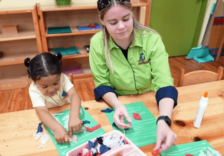 Montessori teacher reading with a young child